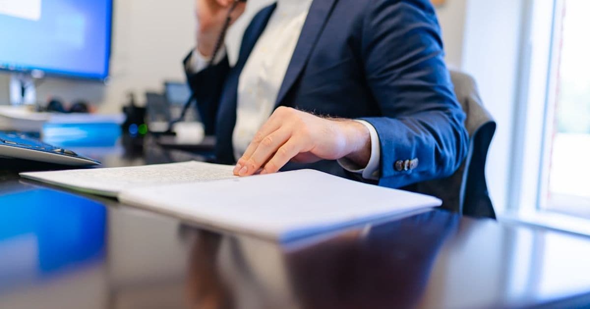 Solicitor reviewing bridging loan legal documents at a desk