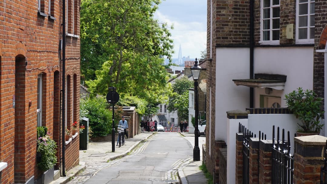 Prime London residential townhouses on a tree-lined street, typical UK bridging loan security