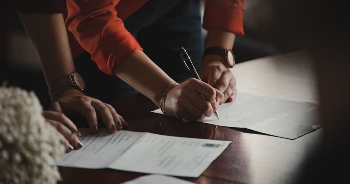 Signed mortgage decision in principle letter alongside loan documents on a desk