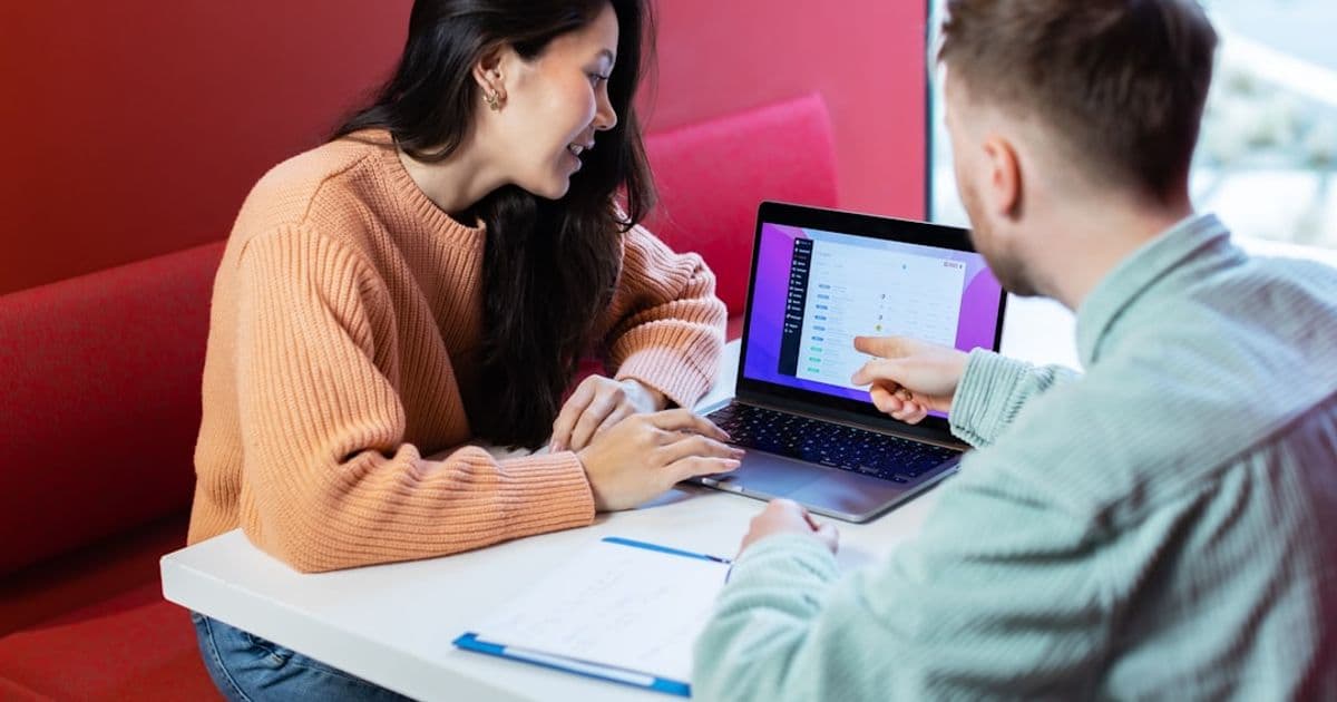 Property developer reviewing loan terms with a lender in a professional office