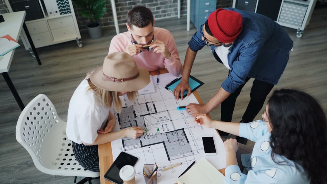 Developer and private lender reviewing exit finance terms at a boardroom meeting
